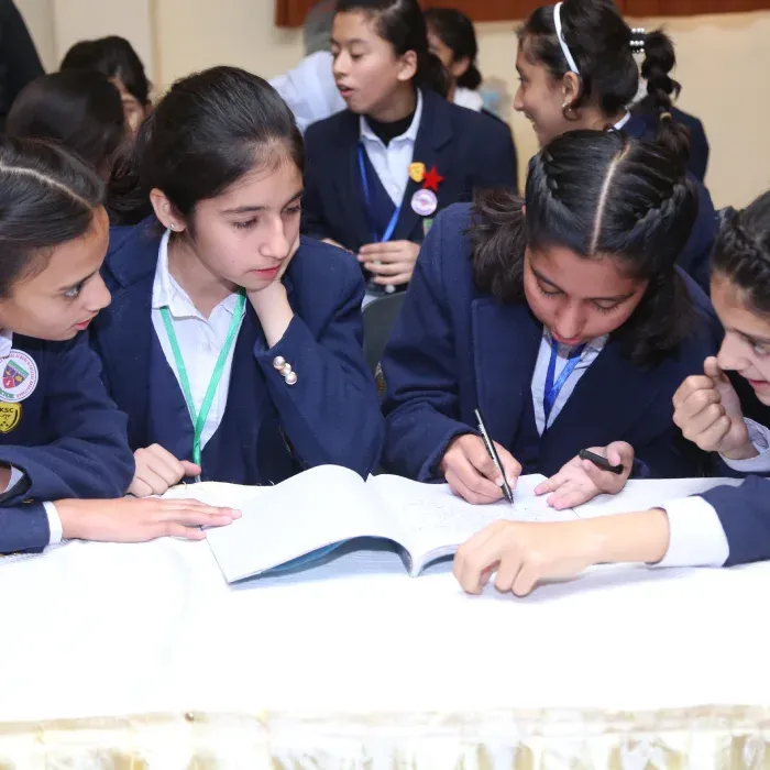 Modernage girls students writing classroom activity