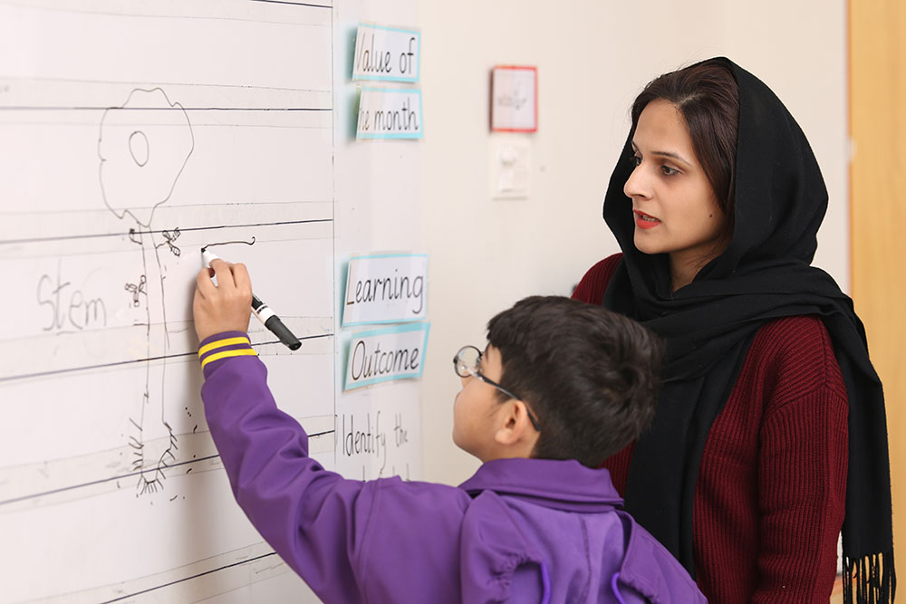 Young student smiling during classroom activity