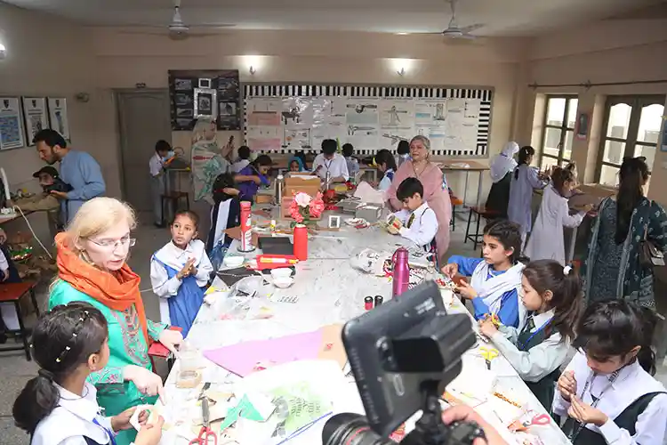 Classroom workshop with children doing craft activities